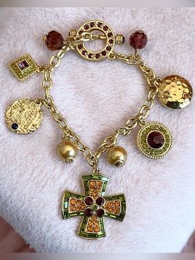 Heidi Daus Gold Multi-Charm Bracelet with Green and Amber Crystal Cross